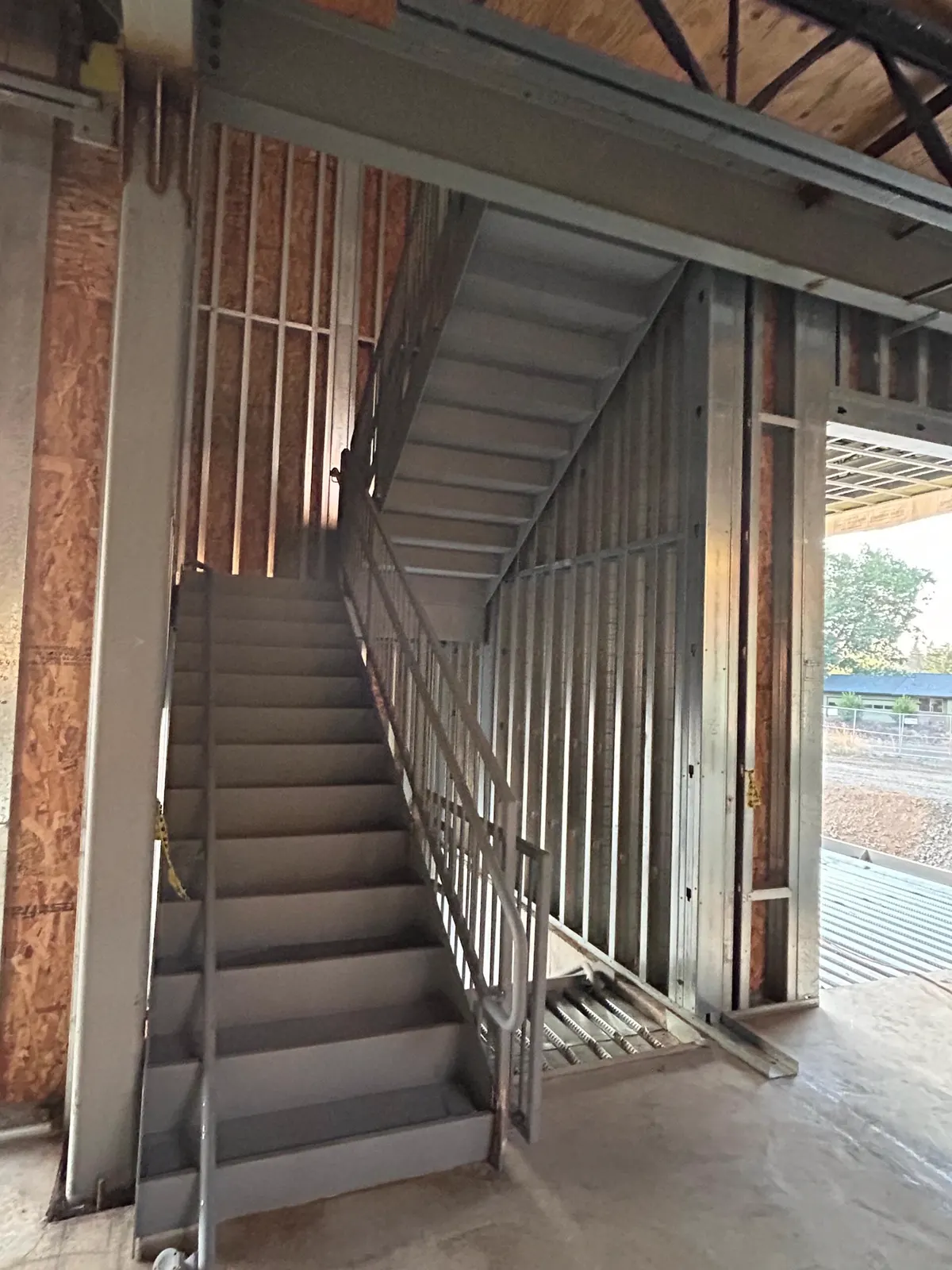 Interior stairs and wall framing during construction in 2025